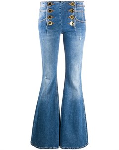 Расклешенные джинсы с эффектом потертости Balmain
